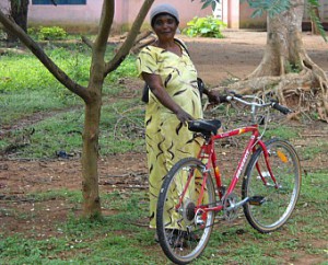 Aminata with her new bike -- read the story on SeeYourImpact.
